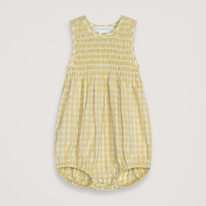 Yellow checkered baby romper on a light gray background