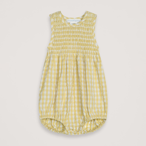 Yellow checkered baby romper on a light gray background