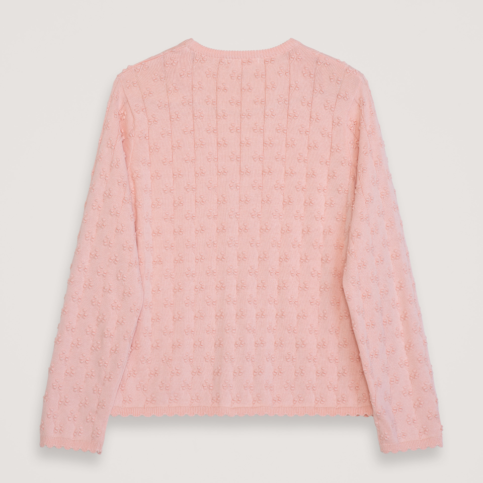 Pink textured long-sleeve sweater on a light gray background