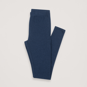 Pair of blue leggings folded on a light gray background