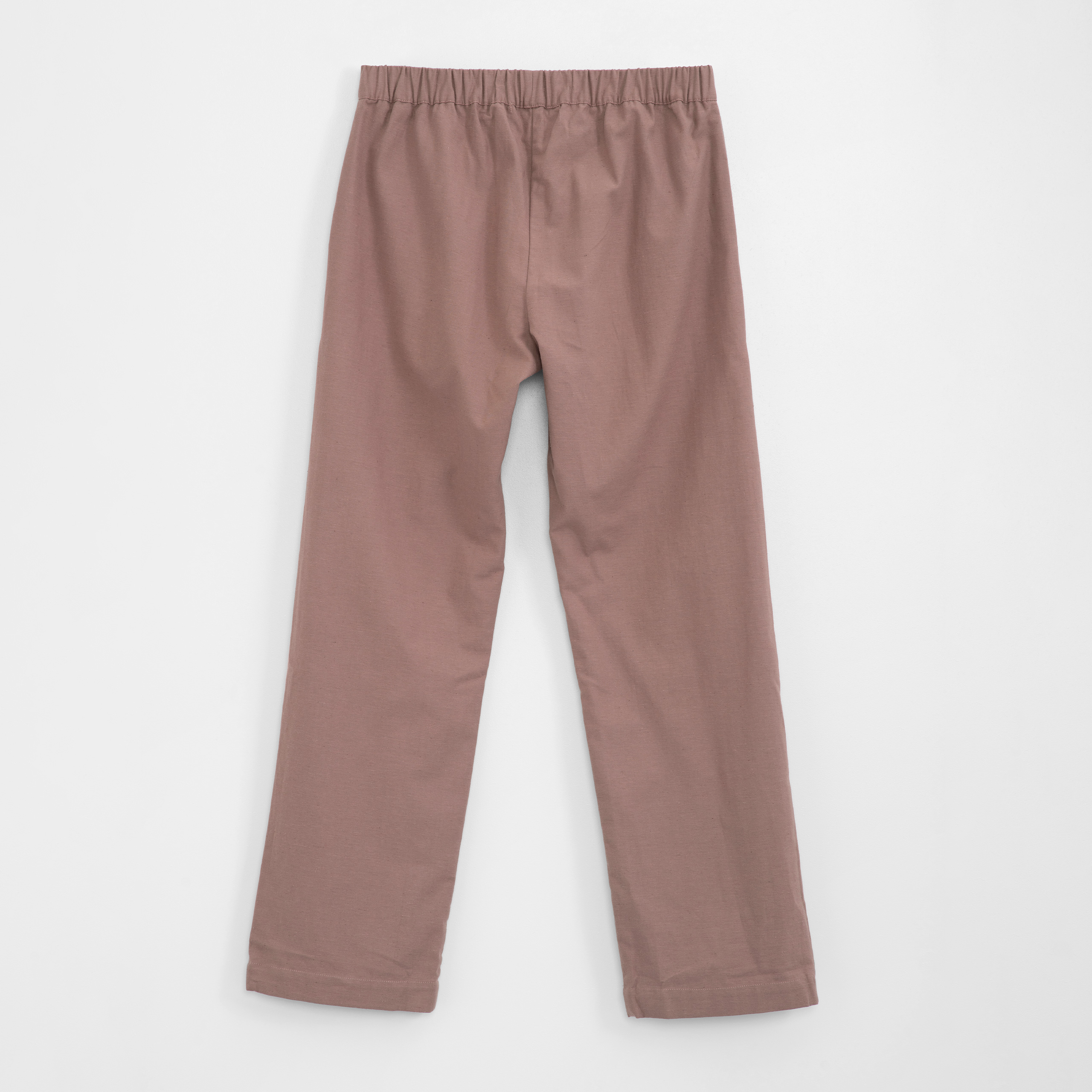 Back of brown pants on a white background