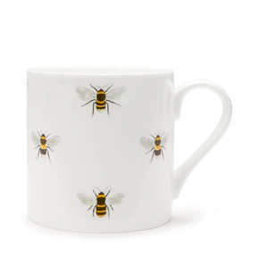 White mug with a bee pattern on a white background