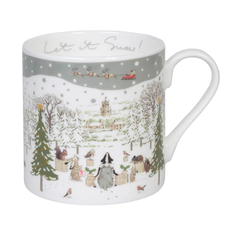 A white china mug featuring a winter Christmas scene with penguins, snow-covered trees, a sleigh, and the text 'Let it Snow!' printed on the inside.