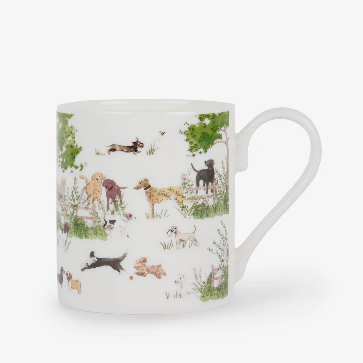 A white china mug featuring a detailed illustration of various dog breeds in a natural outdoor setting with trees and grass.