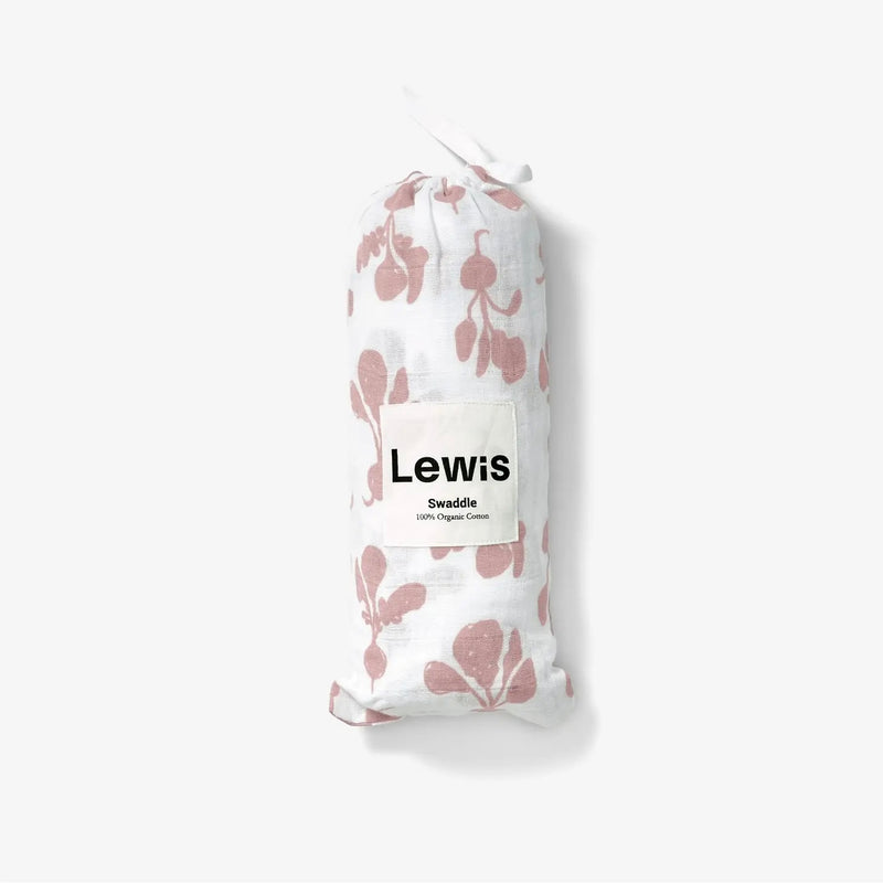 Baby Swaddle - white baby swaddle with mauve radish print in carrying sleeve on a neutral background