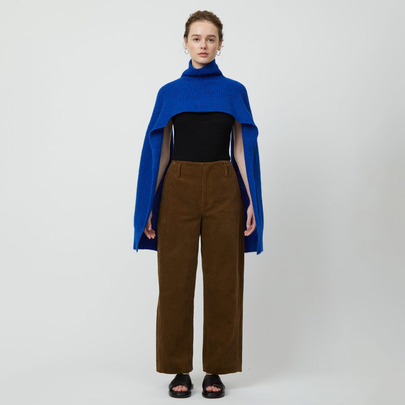 Atelier Delphine Turtle Neck Scarf - model wearing vibrant blue scarf with turtle neck on a neutral background