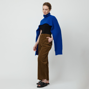Atelier Delphine Turtle Neck Scarf - model wearing vibrant blue scarf with turtle neck on a neutral background