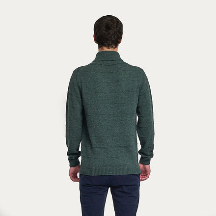 Kuna Washington Sweater - model wearing green sweater with ridged pattern and folded collar on a neutral background