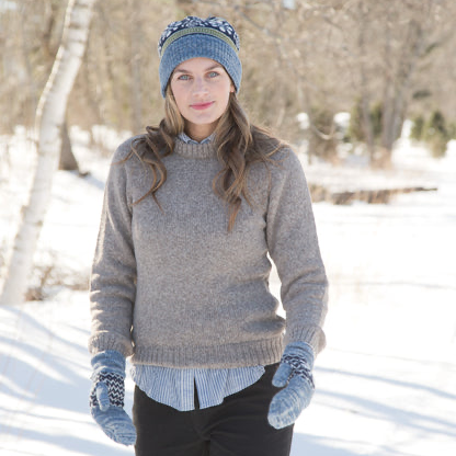 Woman in winter clothing standing in a snowy landscape
