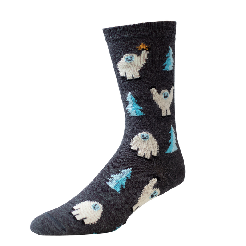 gray sock with white yeti figures and blue trees against white background
