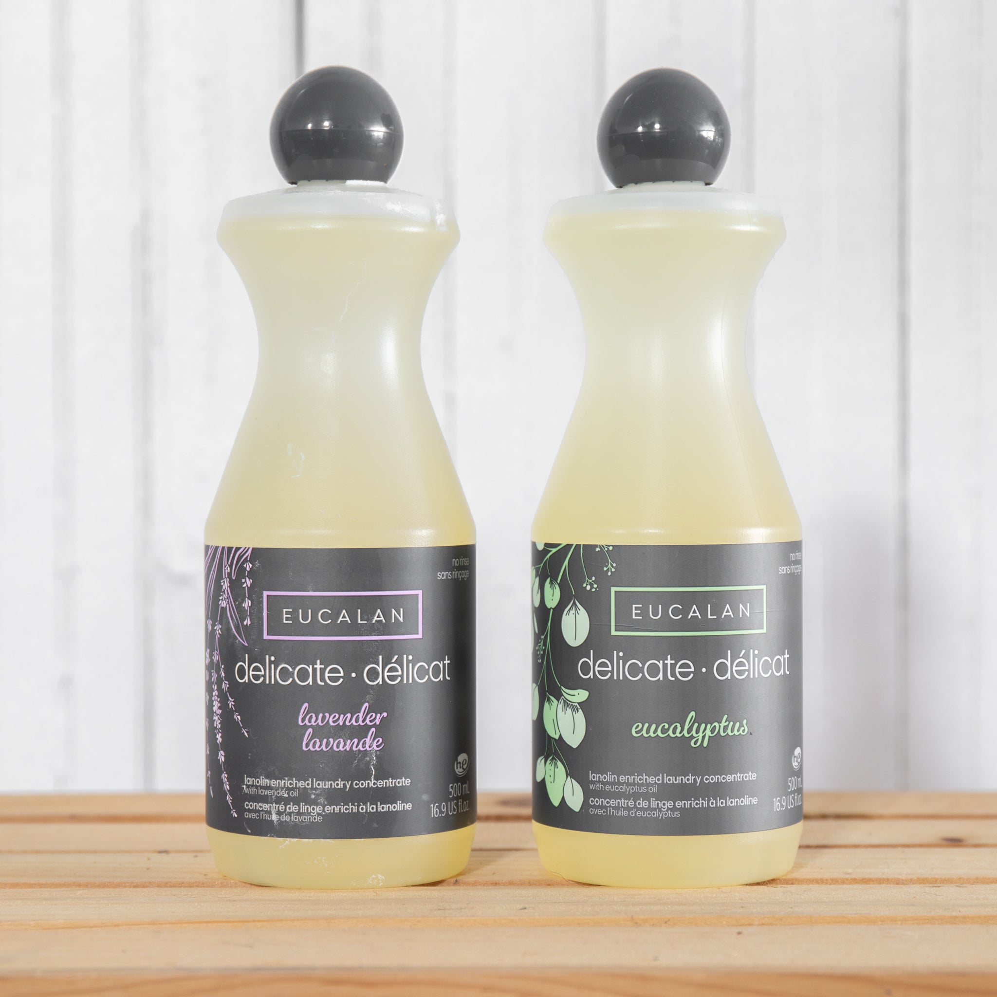 Eucalan No-Rinse Delicate Wash. Two bottles of Eucalan sit on a wooden crate. One is Lavender scented and the other is Eucalpytus.