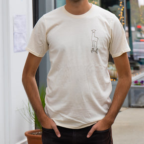 Fluff Alpaca Adult T-Shirts, man wearing a natural white alpaca tshirt in front of a store