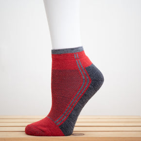 Alpaca Running  and Athletic Ankle Socks. A pair of red alpaca ankle running socks in front of a white background. 