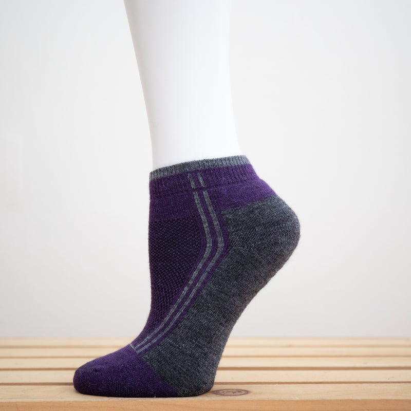 Alpaca Running  and Athletic Ankle Socks. A pair of purple alpaca ankle running socks in front of a white background. 