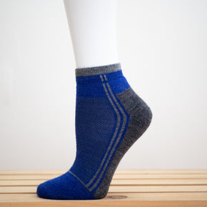 Alpaca Running  and Athletic Ankle Socks. A pair of royal blue alpaca ankle running socks in front of a white background. 