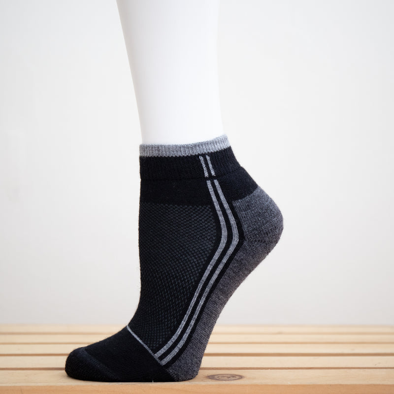 Alpaca Running  and Athletic Ankle Socks. A pair of black alpaca ankle running socks in front of a white background. 