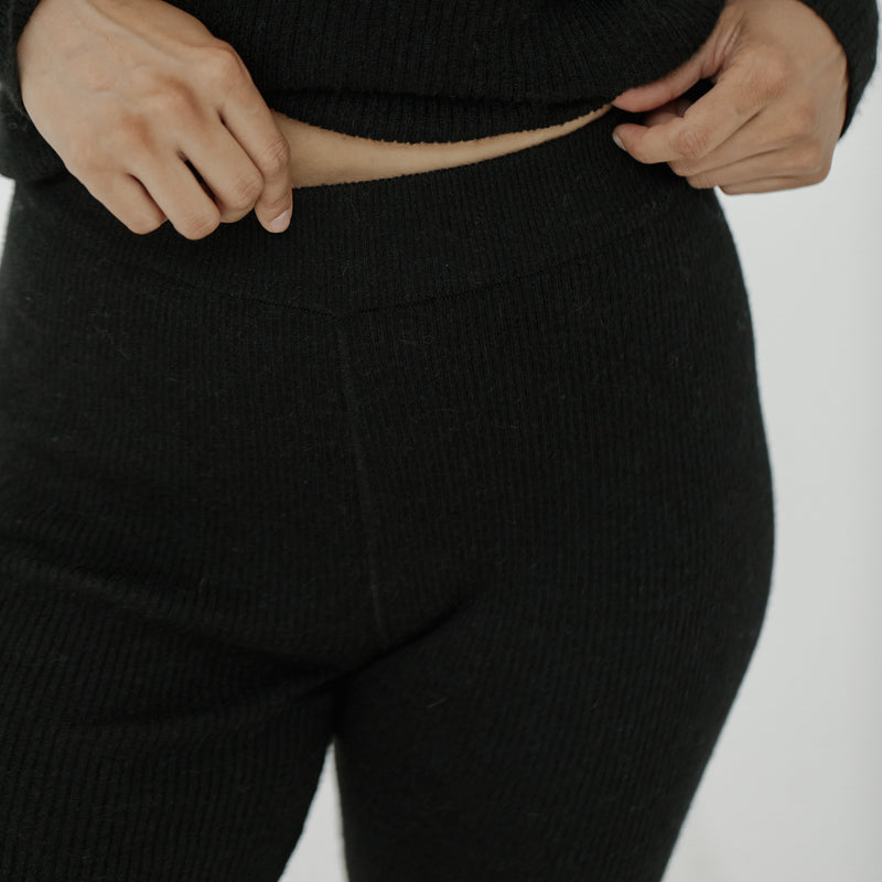 Bare Knitwear Marin Rib Tight - person wearing black tights on a neutral background