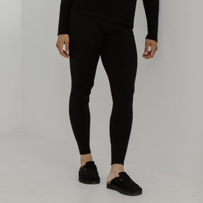 Bare Knitwear Marin Rib Tight - person wearing black tights on a neutral background