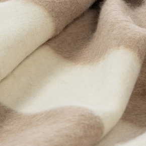 Blacksaw Siempre Recycled Blanket - Beige with Ivory Stripe, a closeup of a beige blanket with a white stripe.