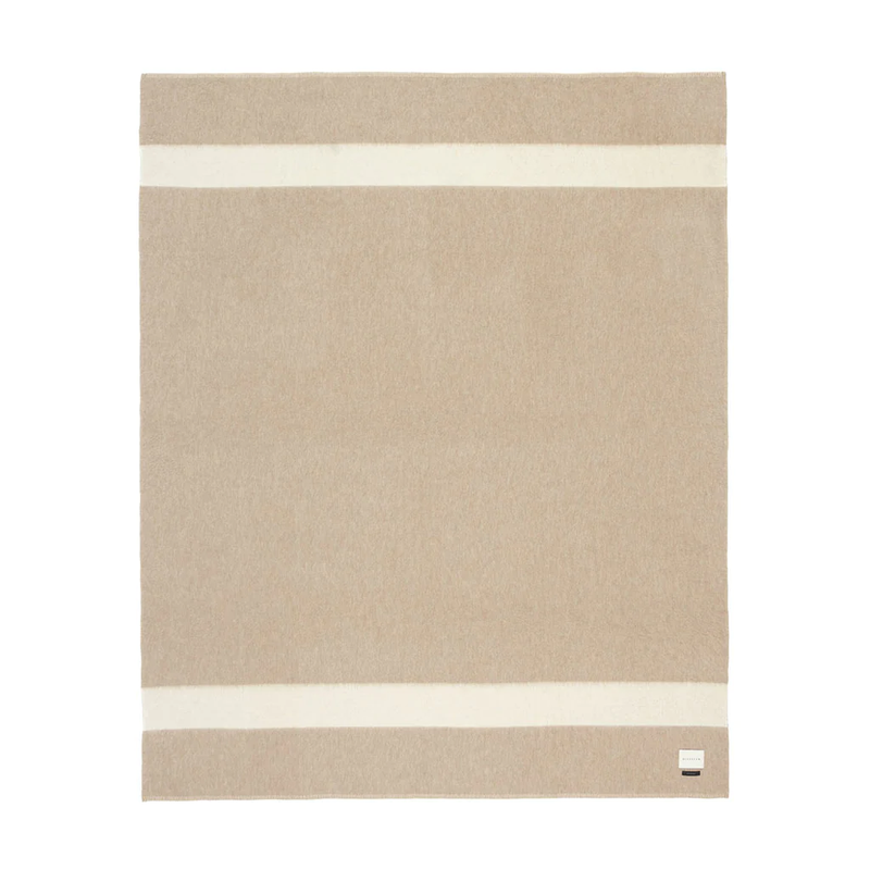 Blacksaw Siempre Recycled Blanket - Beige with Ivory Stripe, a beige blanket with a white stripe lying flat on a white background