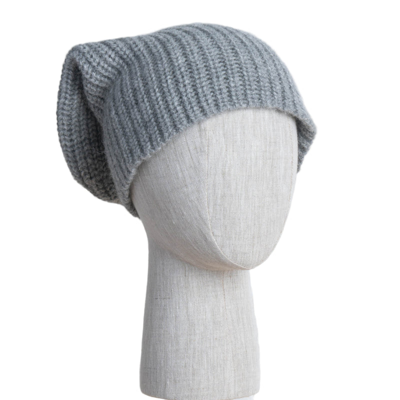 Gray knit beanie on a mannequin head against a white background