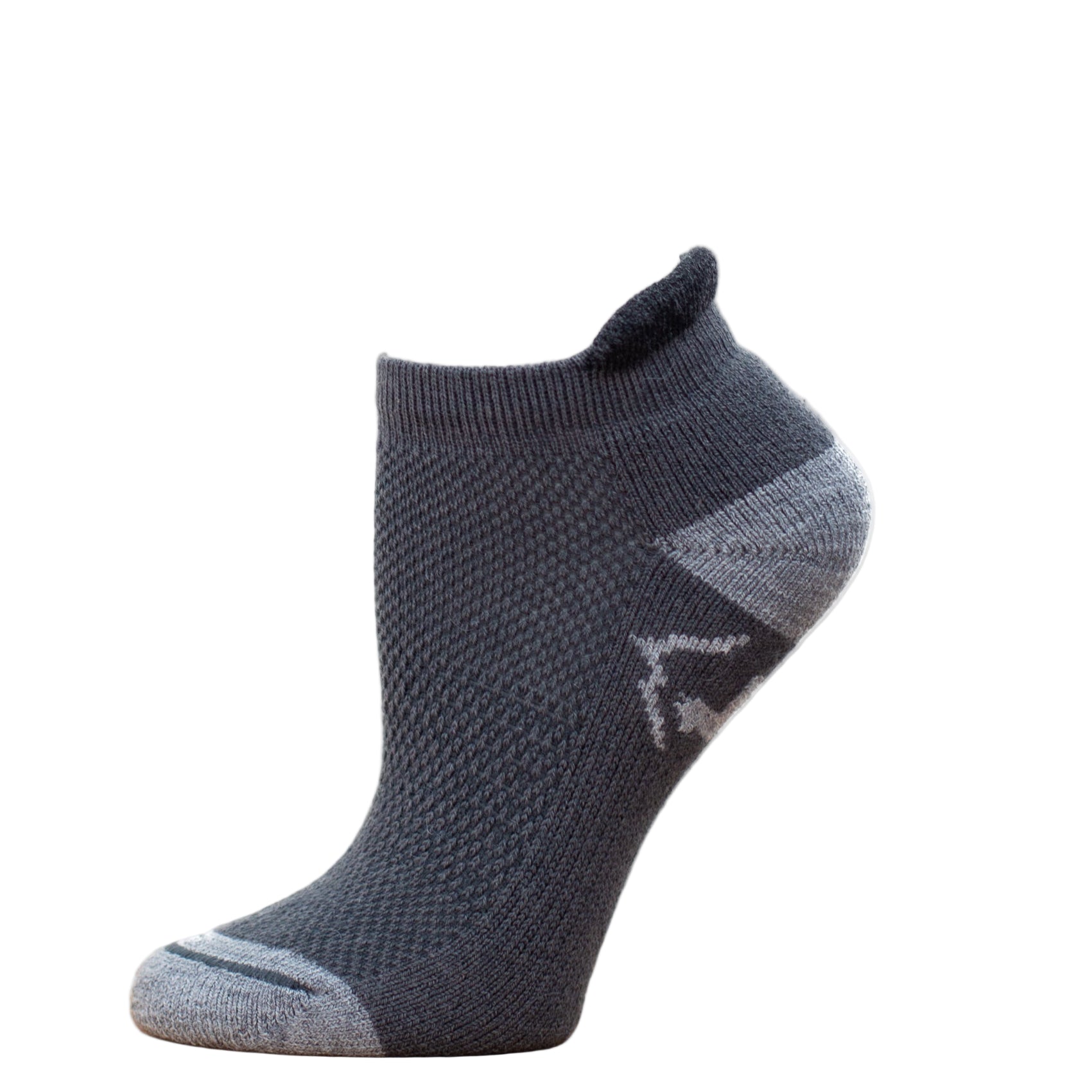 Gray ankle sock on a wooden surface with a white background