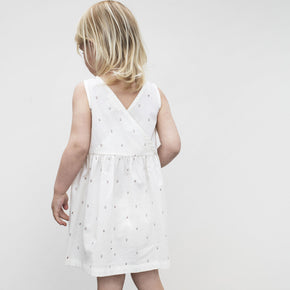 Serendipity Kid's Peasant Dress - 100% Organic Cotton | Fluff Alpaca, the back of a child wearing white peasant dress on a white background