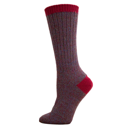 Maroon sock with red trim on a wooden block against a white background