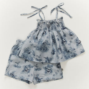 Oeuf Kids Smocked Set – 50% cotton, 50% linen blend for summer, a blue toile smock set on a white background