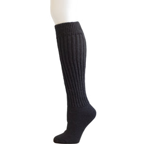 Black knee-high sock on a mannequin leg against a white background