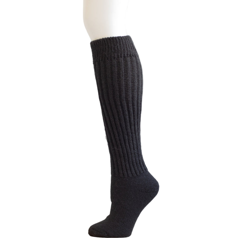 Black knee-high sock on a mannequin leg against a white background