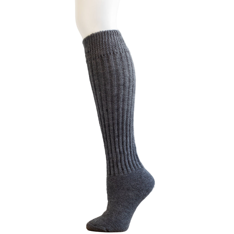Gray knee-high sock on a mannequin leg against a white background