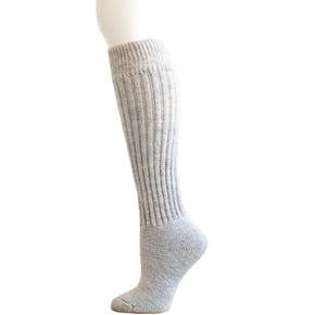 Gray knee-high sock on a mannequin leg against a white background