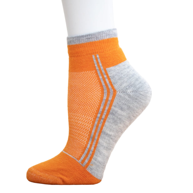 Alpaca Running  and Athletic Ankle Socks. A pair of orange alpaca ankle running socks in front of a white background. 