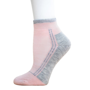 Alpaca Running  and Athletic Ankle Socks. A pair of light pink alpaca ankle running socks in front of a white background. 