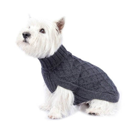 Dog wearing grey cable knit dog sweater on a white background