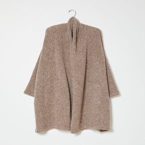 Beige knit wrap coat on white background