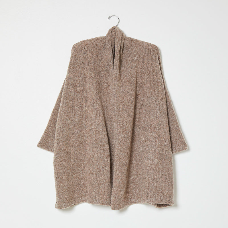 Beige knit wrap coat on white background