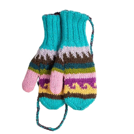 A pair of multicolor hand-knit baby alpaca mittens laid flat on a white wooden surface.