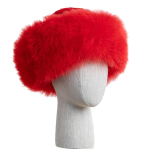 Premium Baby Alpaca Fur Hat. A red Premium Baby Alpaca Fur Hat on a mannequin head against a white paneled background.