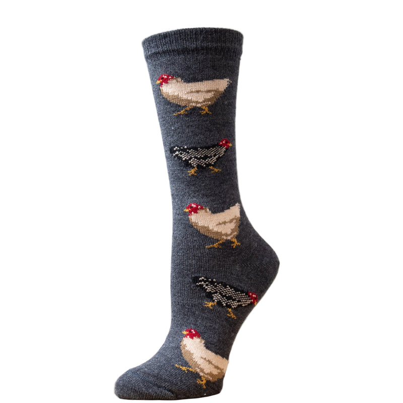 A pair of gray alpaca socks with a pattern of chickens, displayed on a mannequin.