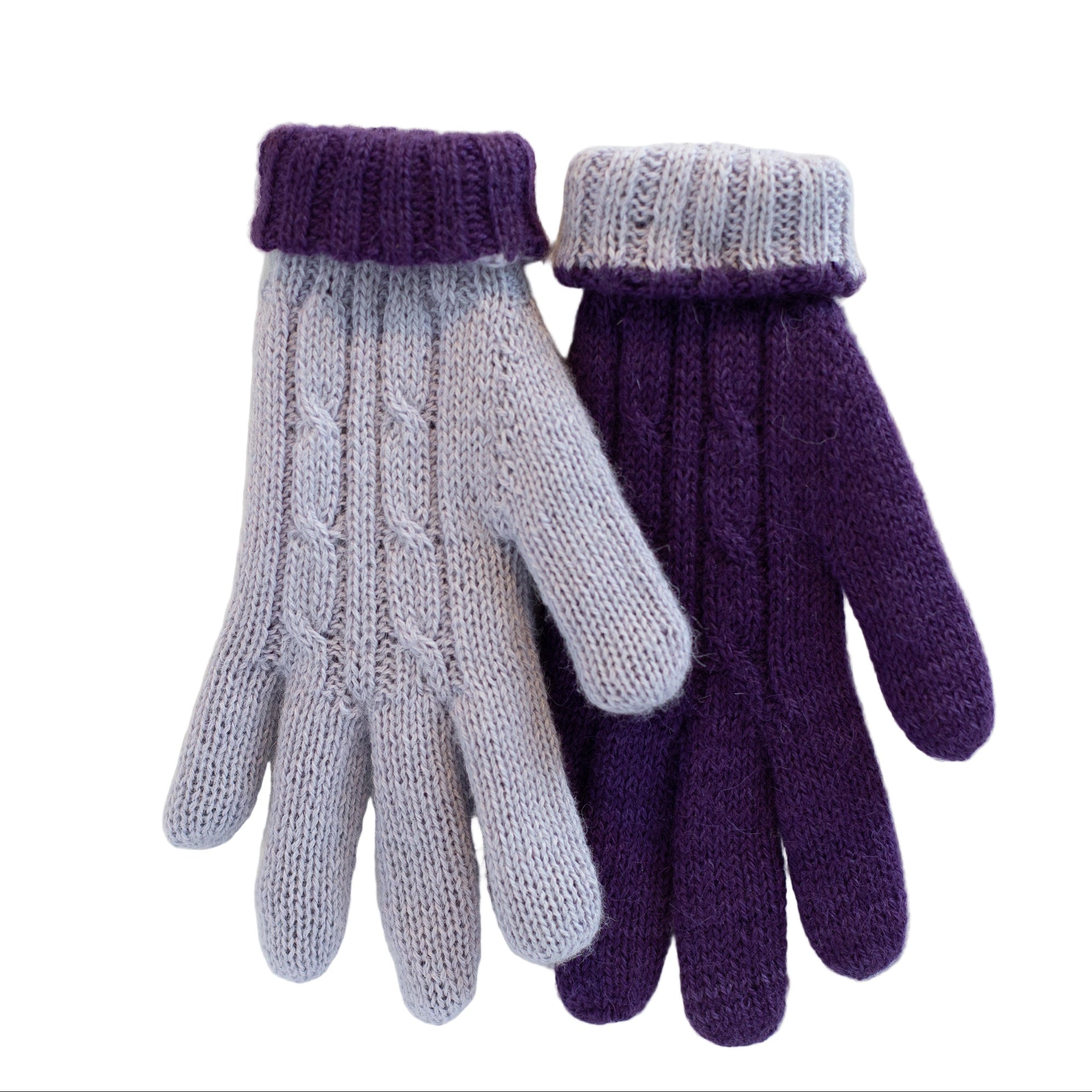 Pair of purple and gray knitted gloves on a white wooden background