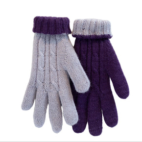 Pair of purple and gray knitted gloves on a white wooden background