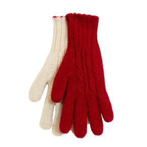 Red and beige knitted gloves on a white wooden surface