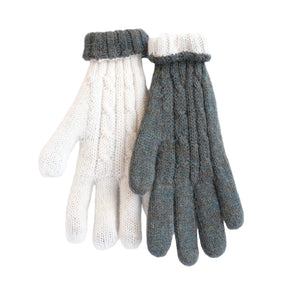 Pair of green and white knitted gloves on a white background