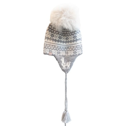 Knitted hat with a pattern and fur on top against a white background
