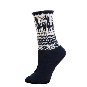 A pair of fair isle patterned ankle socks with a geometric design, primarily in black and white colors, displayed on a wooden surface.