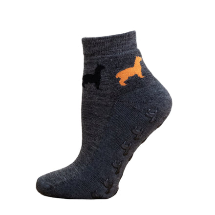 Dark gray ankle sock with orange dog design on a white background