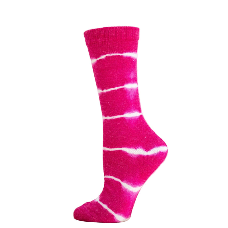 A pair of pink tie-dye alpaca socks on a wooden display platform.